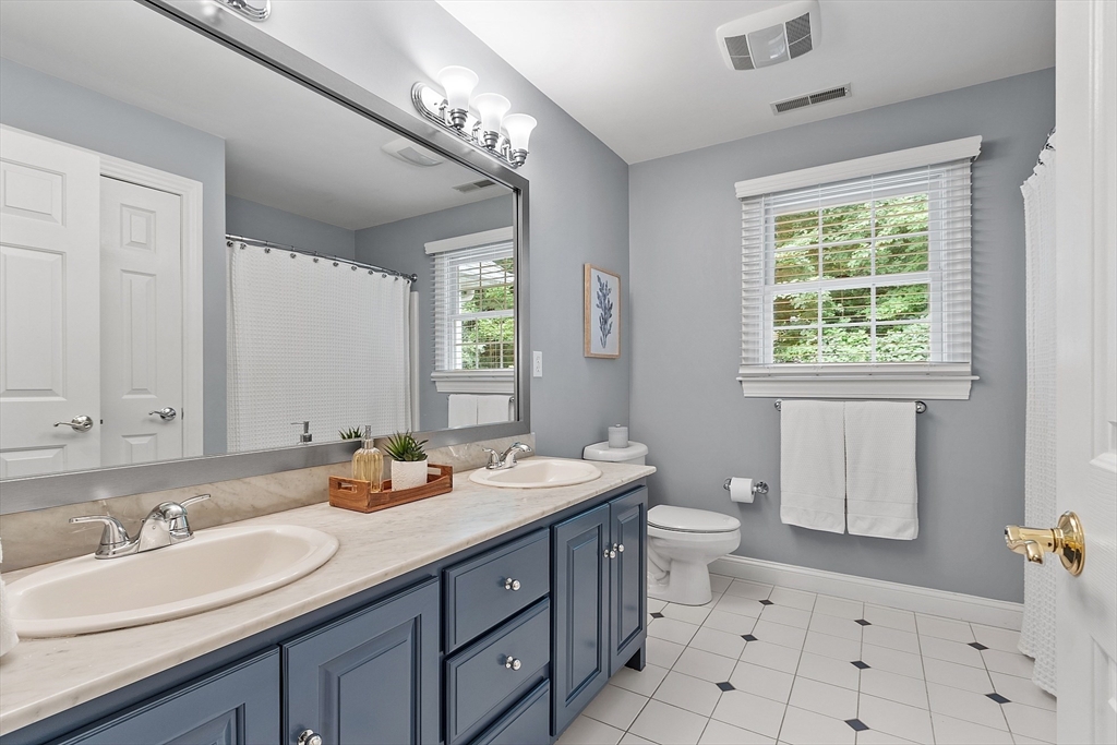 3 Coderre Way Andover, MA 01810 - Photo 37 of 42 a bathroom with a double vanity sink toilet and a mirror