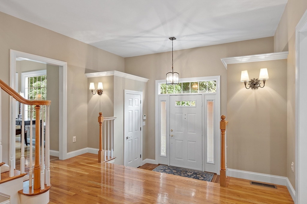 3 Coderre Way Andover, MA 01810 - Photo 4 of 42 a view of livingroom with hardwood floor and hallway