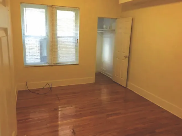 a view of an empty room with a window