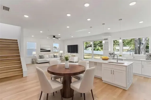 a kitchen with a table and chairs in it