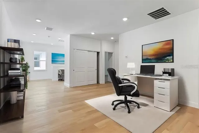 a view of a workspace with furniture