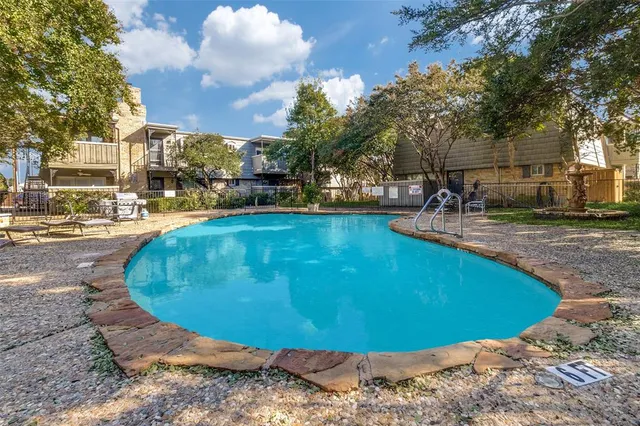 a view of a swimming pool with an outdoor space