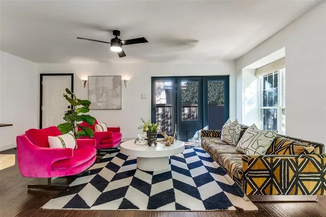 a living room with furniture and a rug