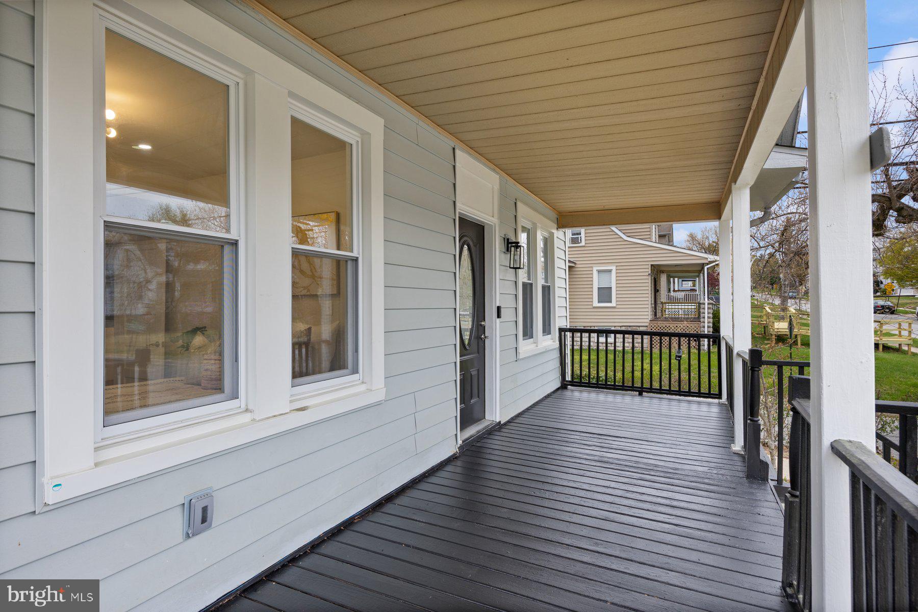 5512 Tramore Road Baltimore, MD 21214 - Photo 3 of 37 a view of a porch with a table and chairs