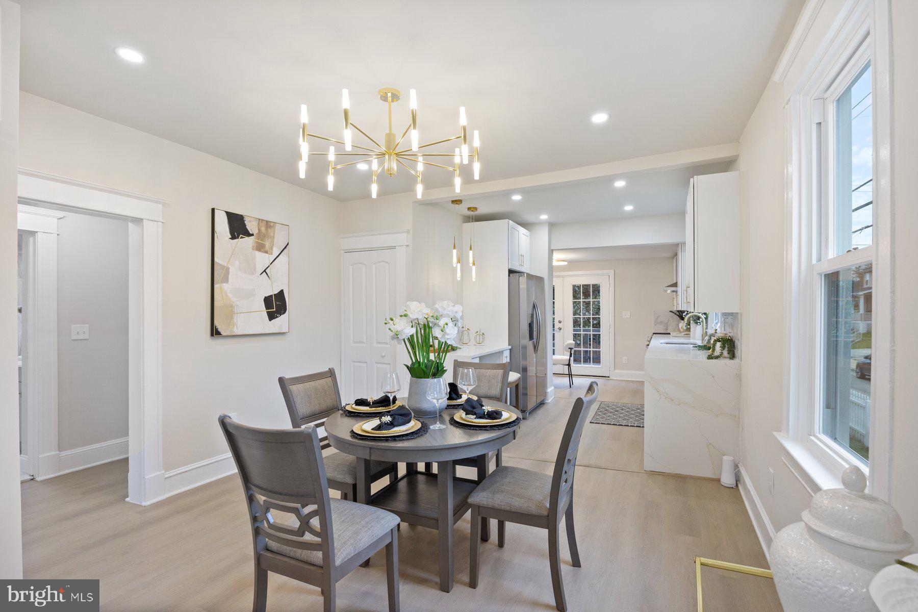 5512 Tramore Road Baltimore, MD 21214 - Photo 7 of 37 a view of a dining room with furniture and chandelier