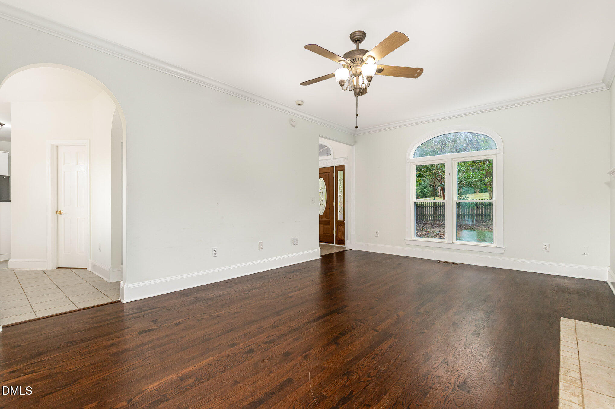 9261 Blackley Lake Road Wake Forest, NC 27587 - Photo 10 of 41 a view of an empty room with wooden floor and a window