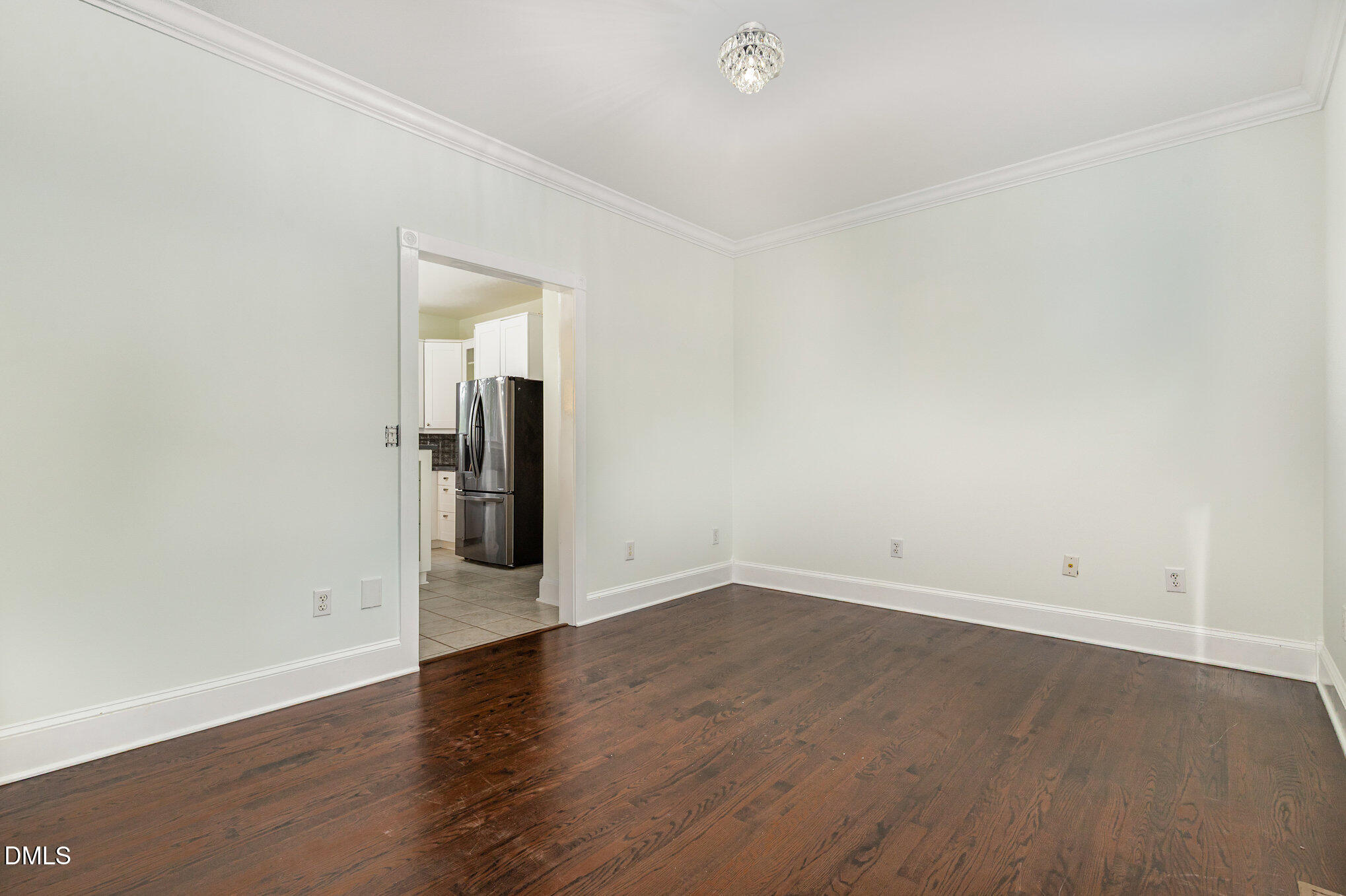 9261 Blackley Lake Road Wake Forest, NC 27587 - Photo 18 of 41 an empty room with wooden floor and mirror