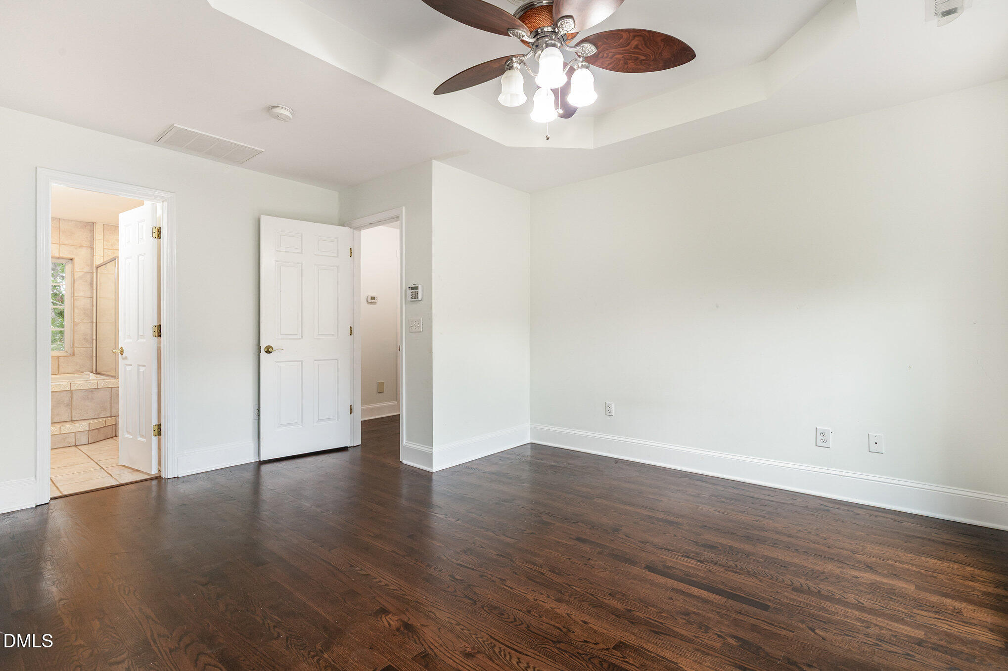 9261 Blackley Lake Road Wake Forest, NC 27587 - Photo 21 of 41 an empty room with wooden floor and windows