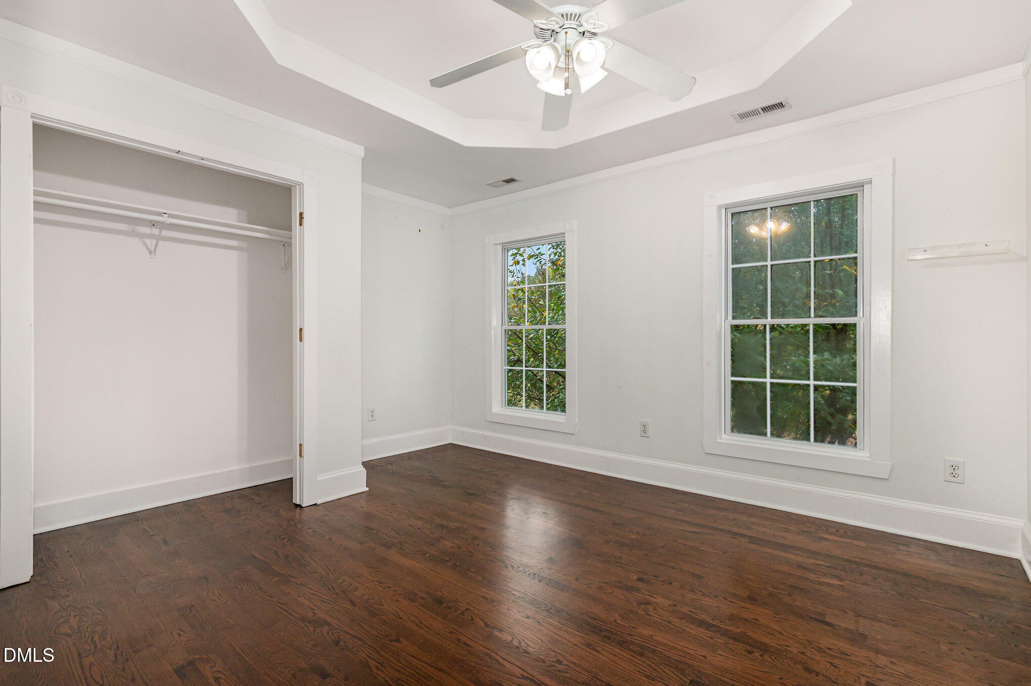 9261 Blackley Lake Road Wake Forest, NC 27587 - Photo 27 of 41 a view of an empty room with wooden floor and window