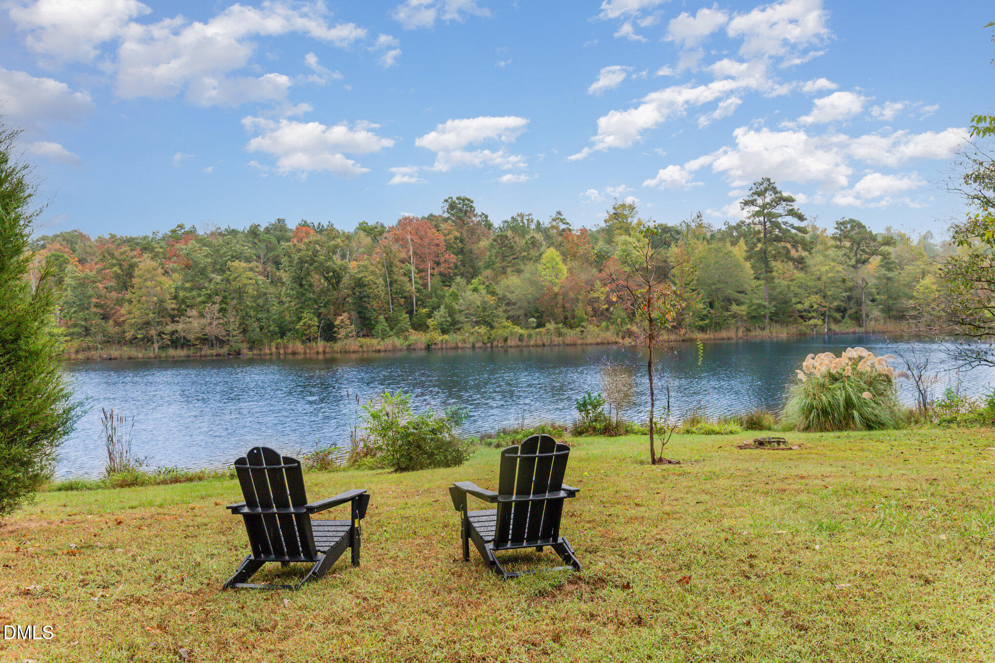 9261 Blackley Lake Road Wake Forest, NC 27587 - Photo 2 of 41 a backyard of a house with table and chairs
