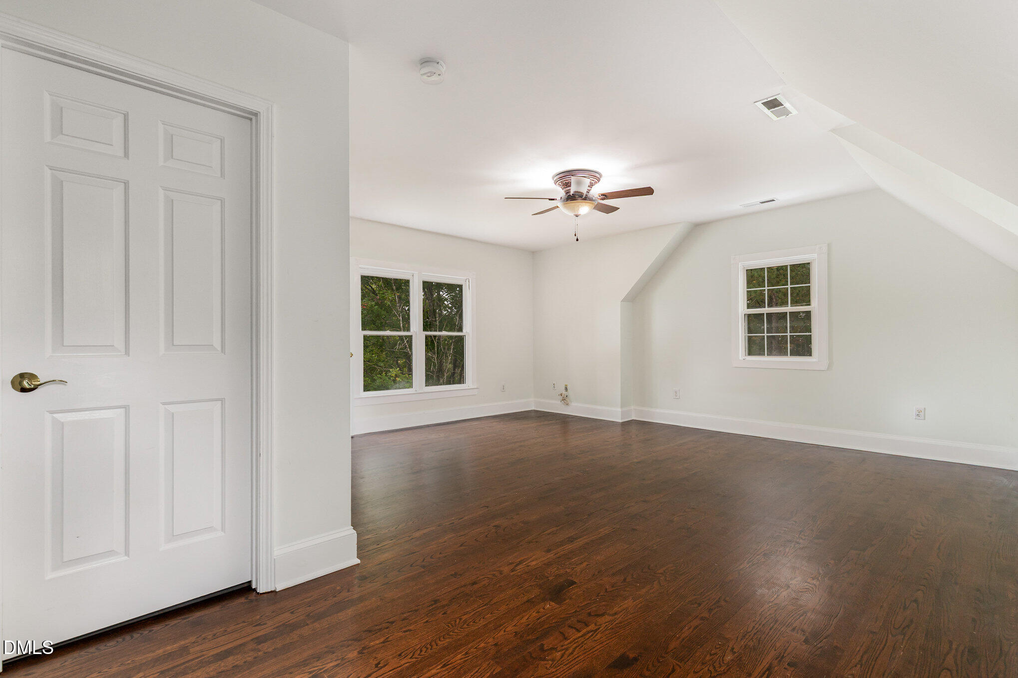 9261 Blackley Lake Road Wake Forest, NC 27587 - Photo 29 of 41 a view of an empty room with a window and wooden floor
