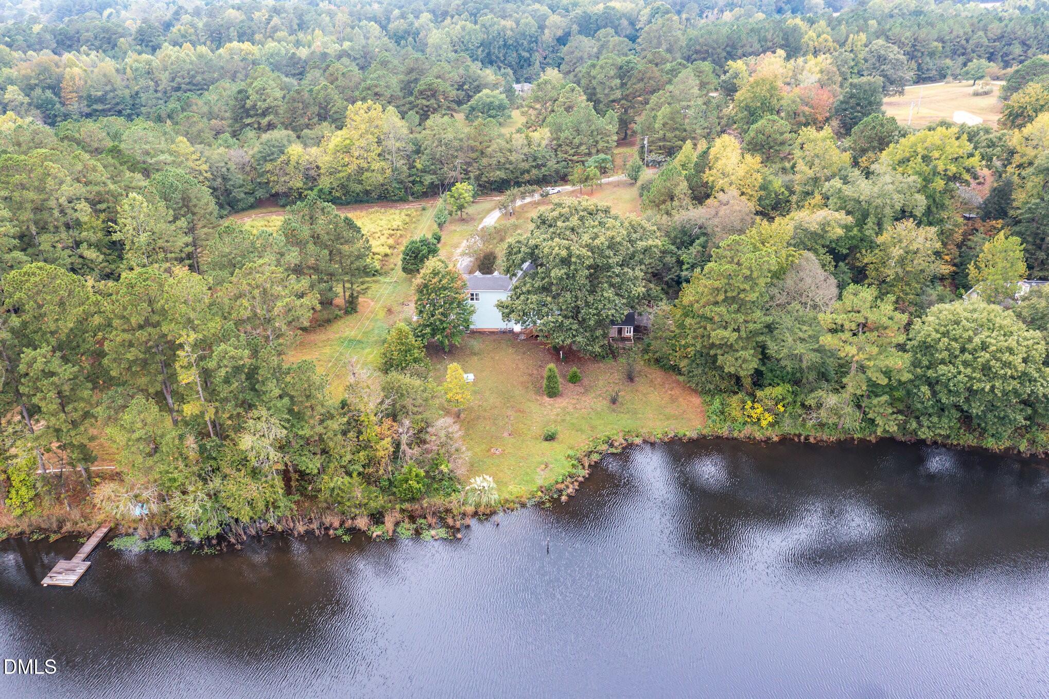 9261 Blackley Lake Road Wake Forest, NC 27587 - Photo 35 of 41 a view of a lake with a yard