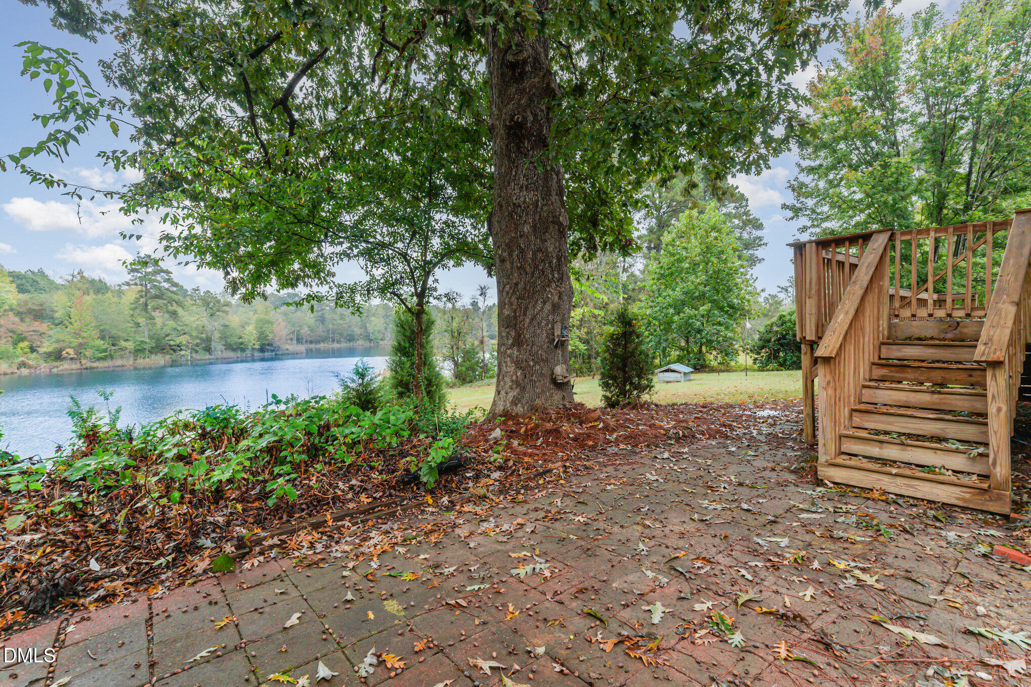 9261 Blackley Lake Road Wake Forest, NC 27587 - Photo 37 of 41 a view of a garden with wooden deck