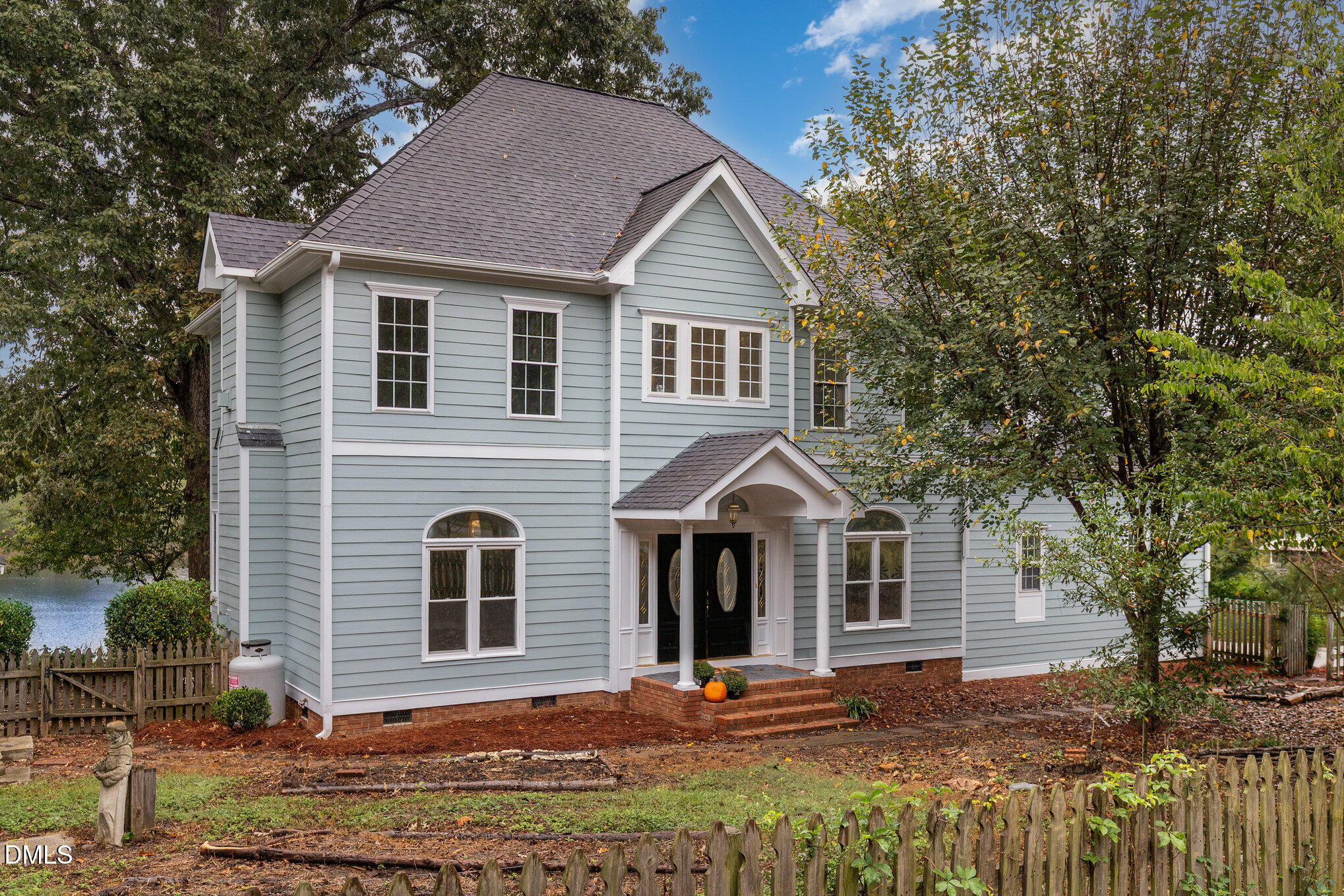 9261 Blackley Lake Road Wake Forest, NC 27587 - Photo 3 of 41 a front view of a house with a yard
