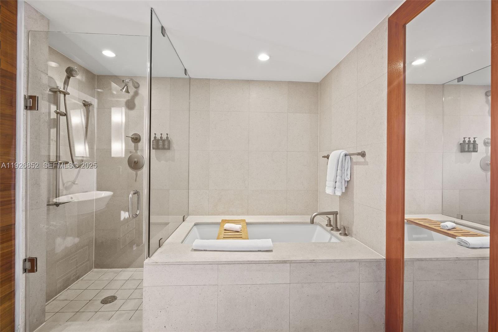 6801 Collins Avenue, Unit 614 Miami Beach, FL 33141 - Photo 11 of 49 a bathroom with a sink a toilet and shower