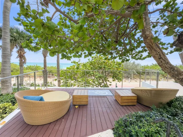 swimming pool view with a seating space