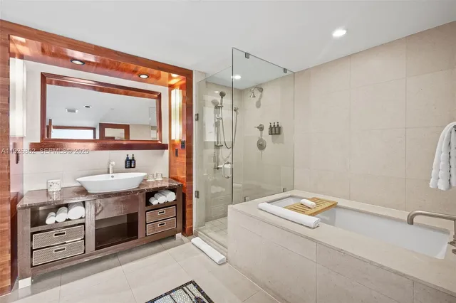 a bathroom with a sink a vanity and mirror