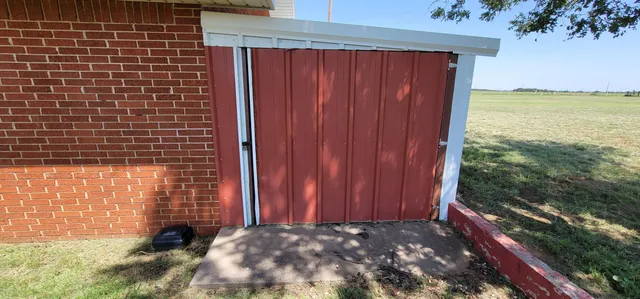 a view of backyard with potted plants
