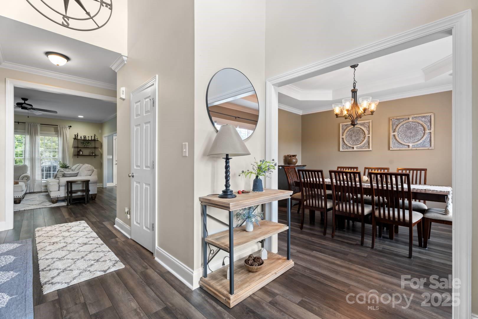 153 Canyon Road Mocksville, NC 27028 - Photo 11 of 46 a view of a livingroom kitchen and dining room with wooden floor