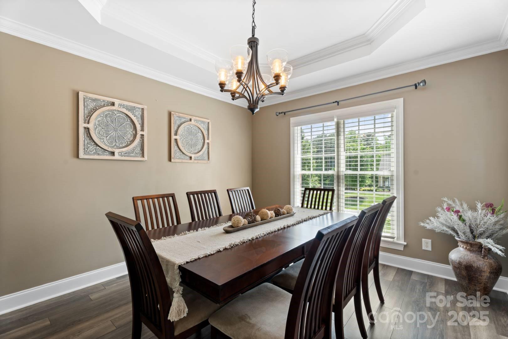 153 Canyon Road Mocksville, NC 27028 - Photo 13 of 46 a view of a dining room with furniture window and wooden floor