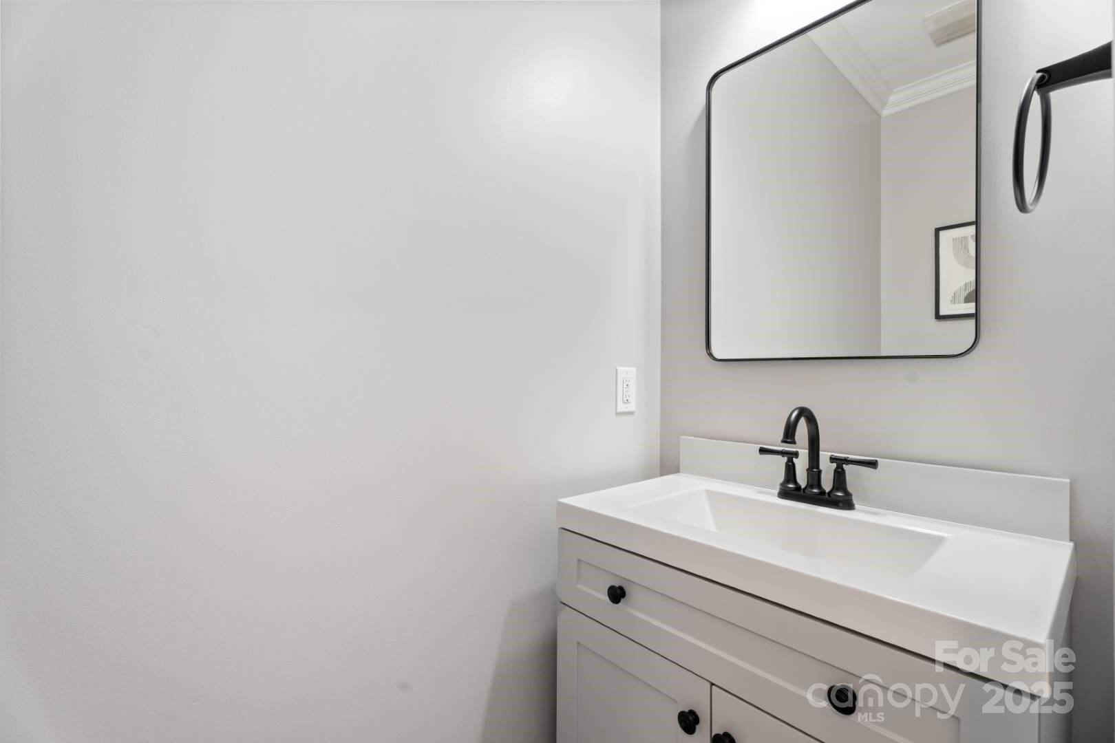 153 Canyon Road Mocksville, NC 27028 - Photo 22 of 46 a bathroom with a sink and a mirror