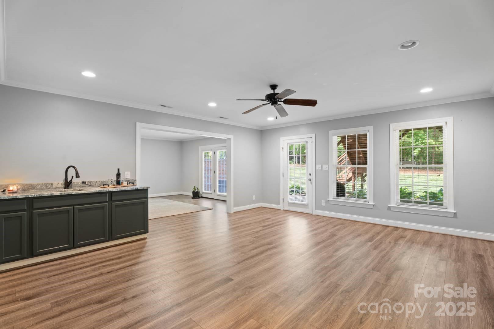 153 Canyon Road Mocksville, NC 27028 - Photo 38 of 46 a view of an empty room with wooden floor and a window