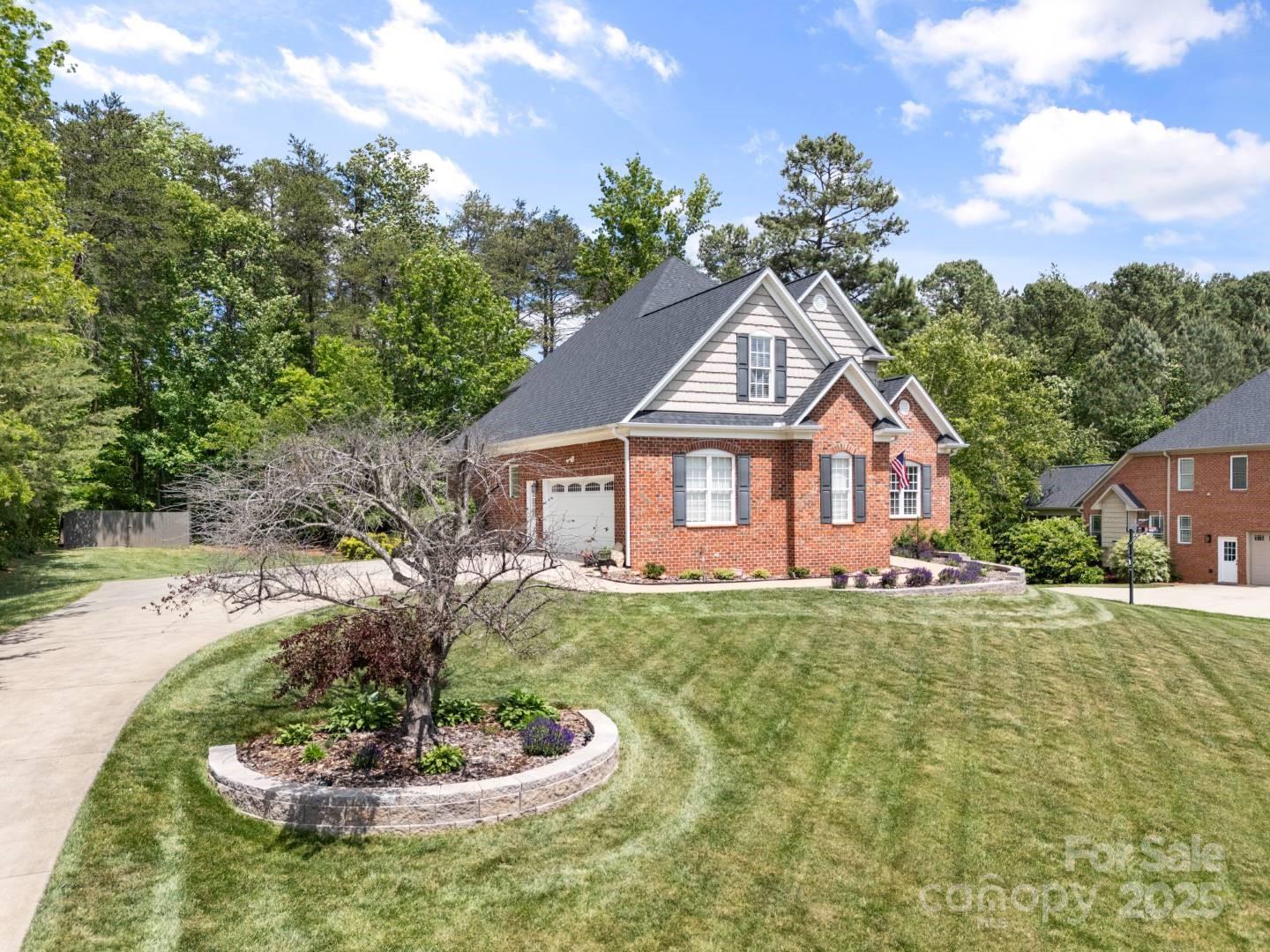 153 Canyon Road Mocksville, NC 27028 - Photo 4 of 46 a front view of a house with a yard