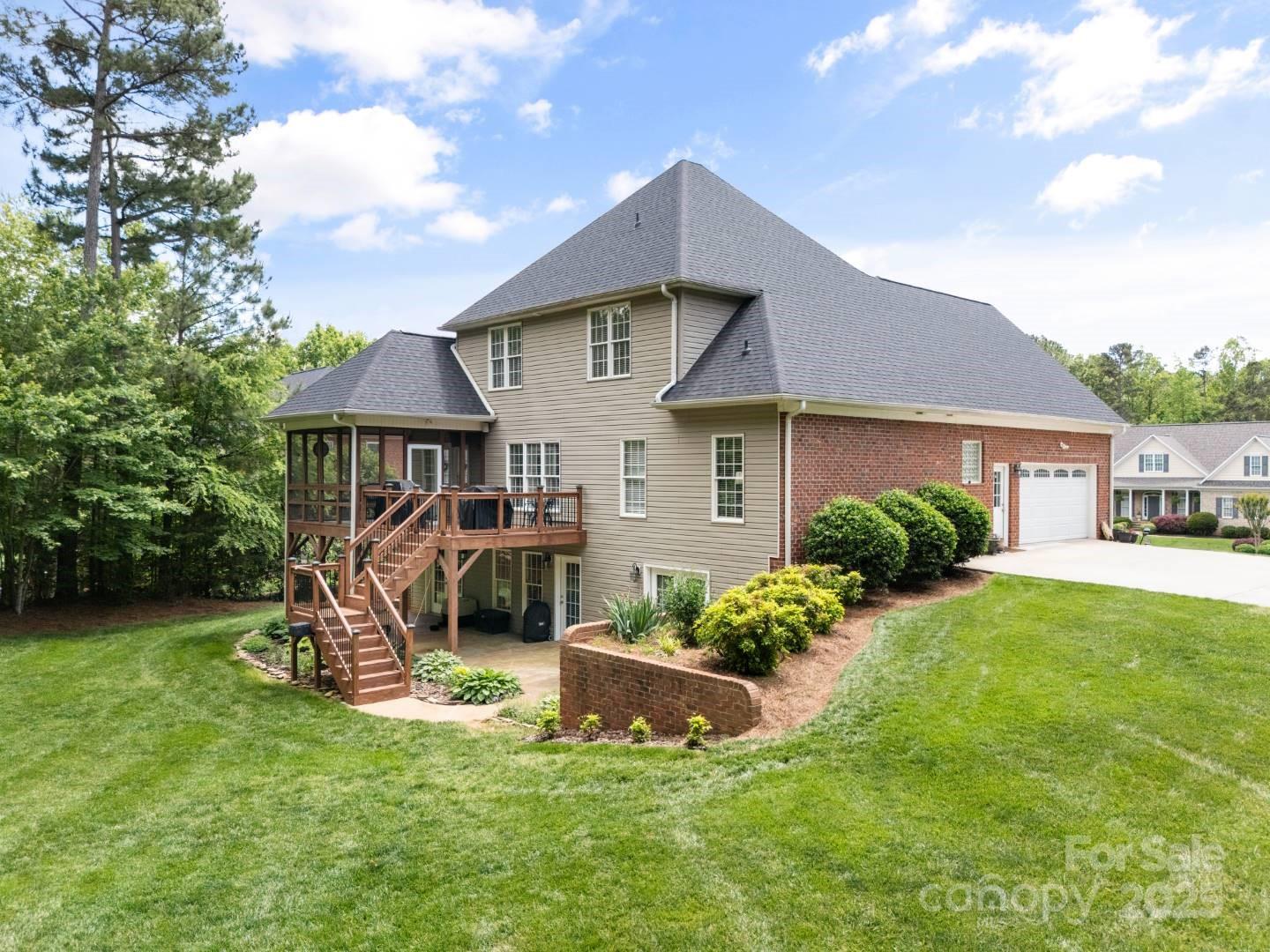 153 Canyon Road Mocksville, NC 27028 - Photo 5 of 46 a front view of a house with a yard table and chairs