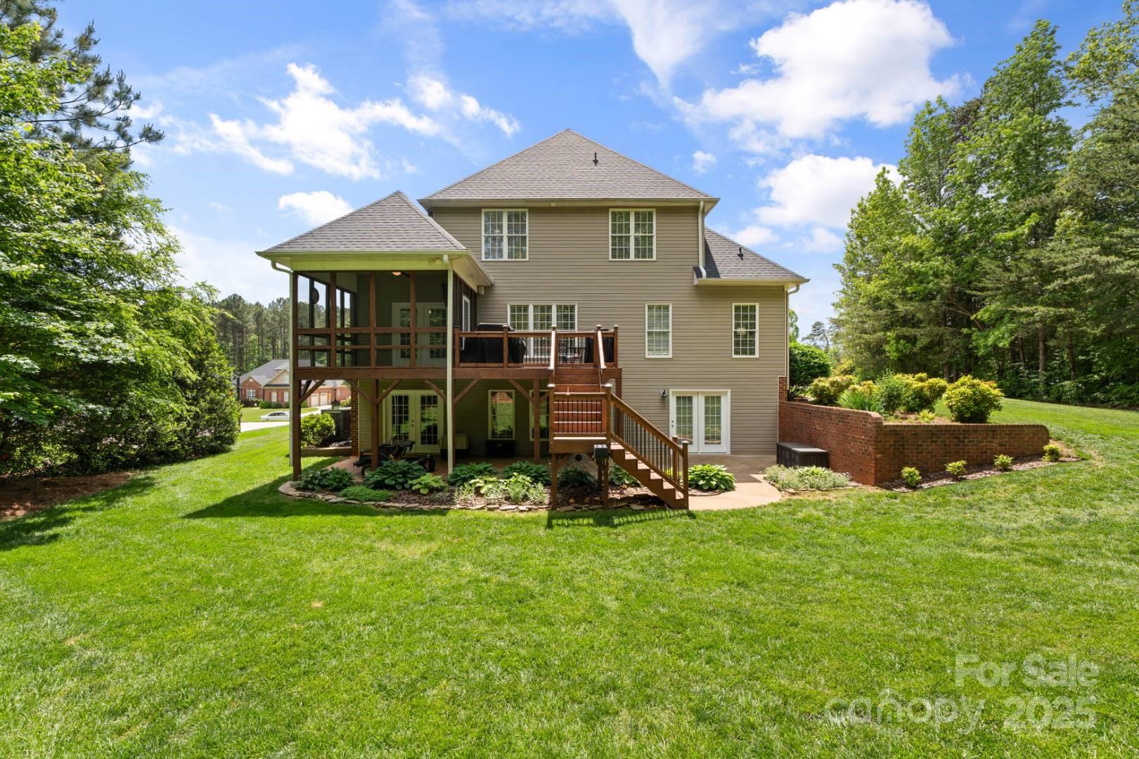 153 Canyon Road Mocksville, NC 27028 - Photo 6 of 46 a view of a chair and table in backyard of the house