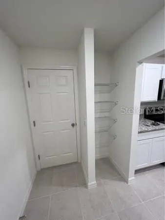 a view of kitchen and white appliances
