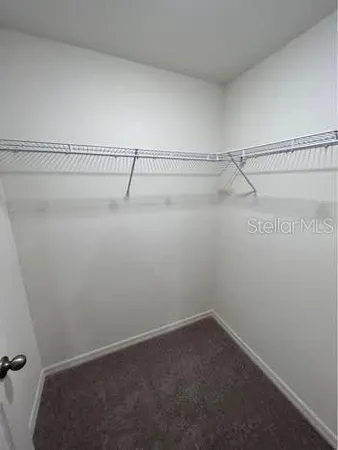 a view of a room with racks on the wall