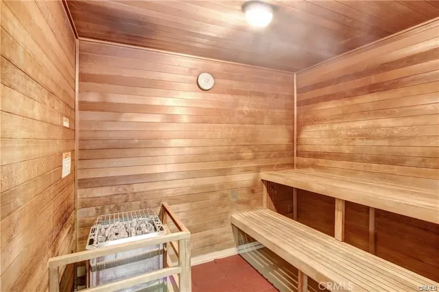 a reading room with furniture and a potted plant