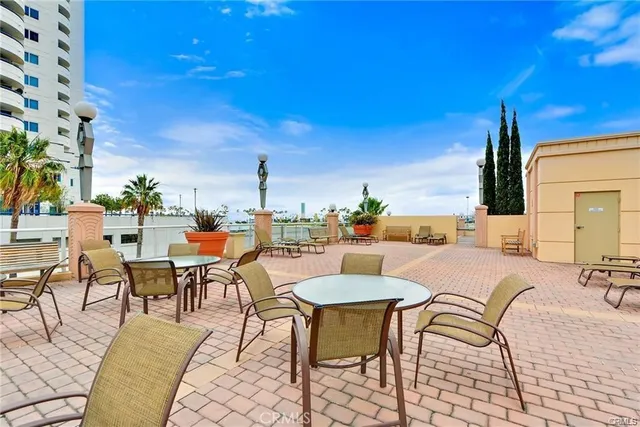 a city street with tall buildings in the background