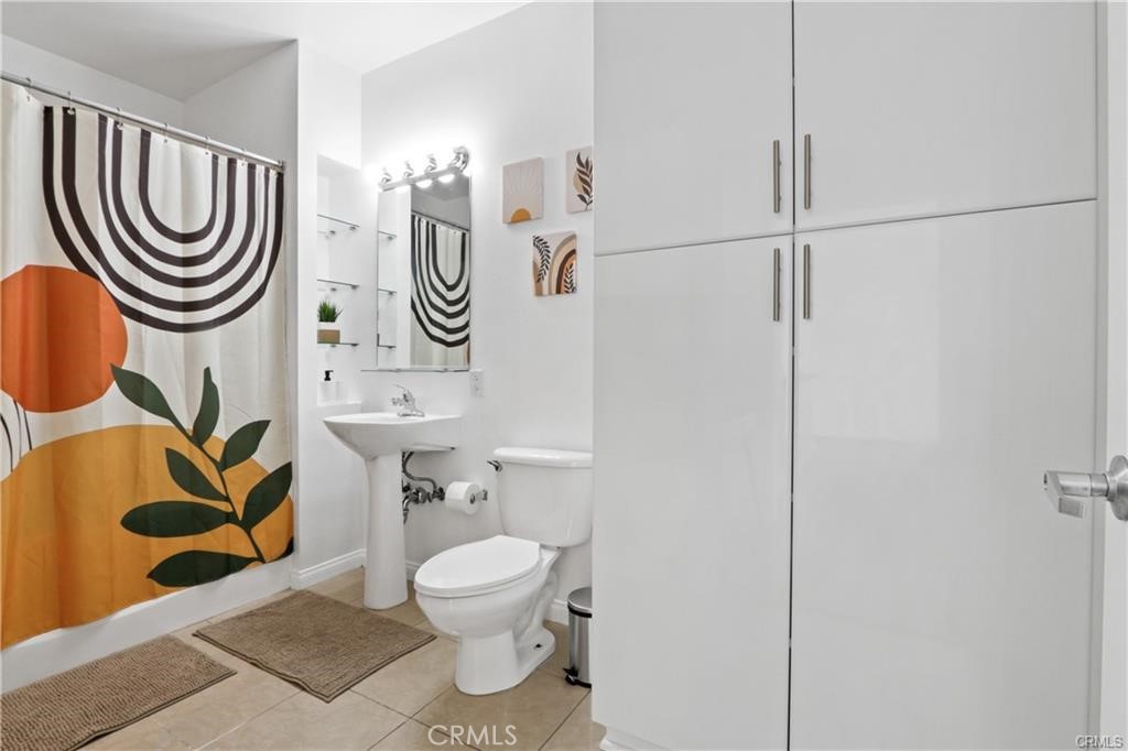 488 East Ocean Boulevard, Unit 618 Long Beach, CA 90802 - Photo 6 of 26 a bathroom with a toilet and a sink