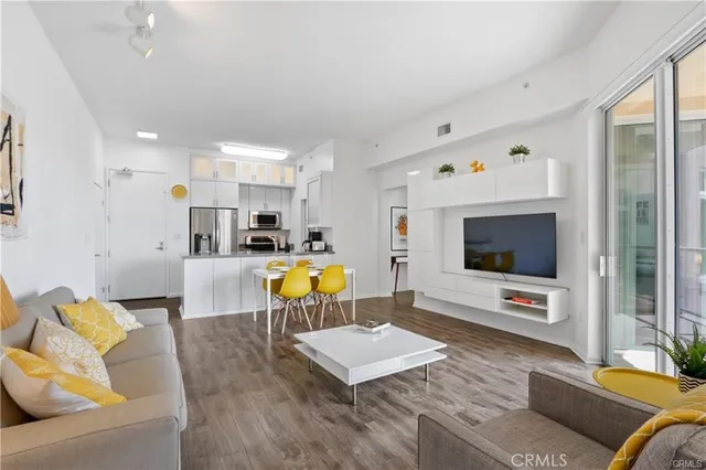 a living room with furniture and flat screen tv