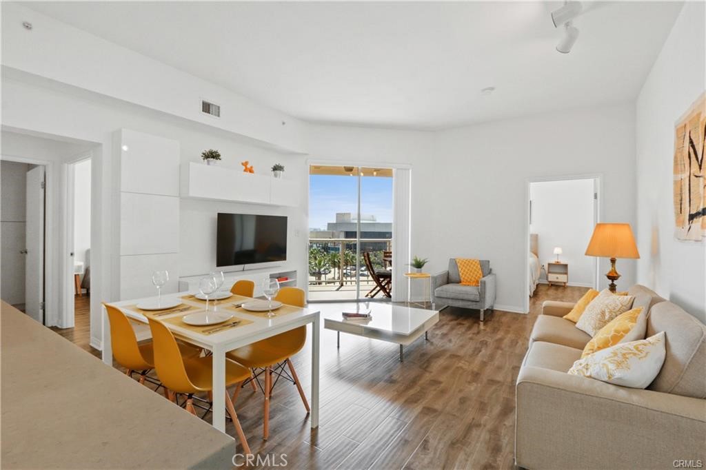 488 East Ocean Boulevard, Unit 618 Long Beach, CA 90802 - Photo 8 of 26 a living room with furniture and flat screen tv
