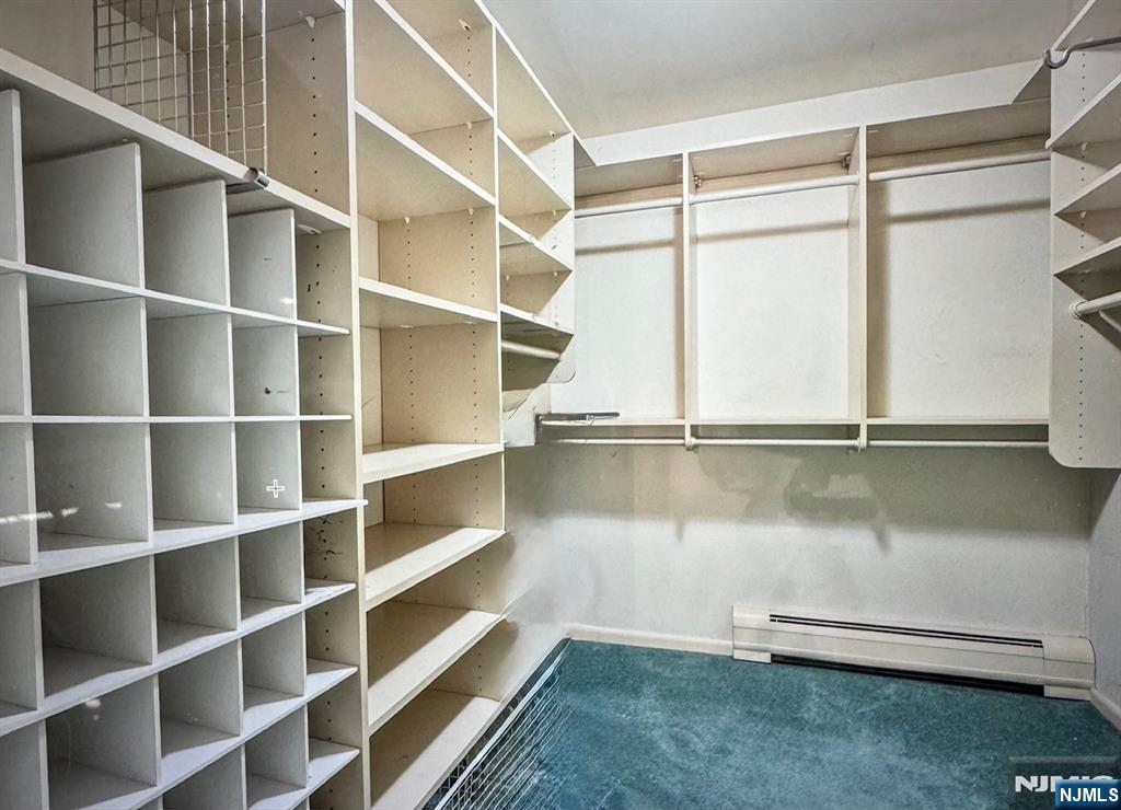 444B Bromley Place Wyckoff, NJ 07481 - Photo 17 of 26 a view of walk in closet with empty racks