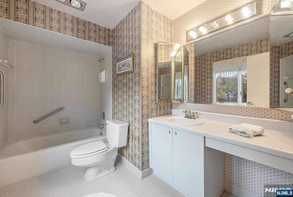 444B Bromley Place Wyckoff, NJ 07481 - Photo 21 of 26 a bathroom with a sink a toilet and shower