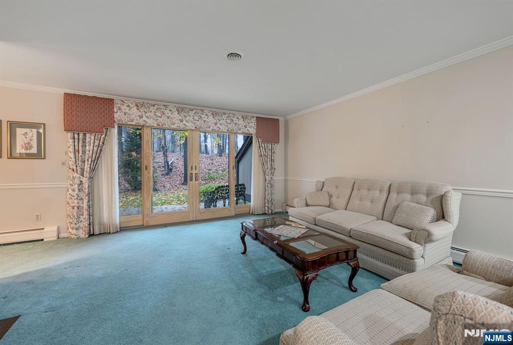 444B Bromley Place Wyckoff, NJ 07481 - Photo 4 of 26 a living room with furniture and a large window