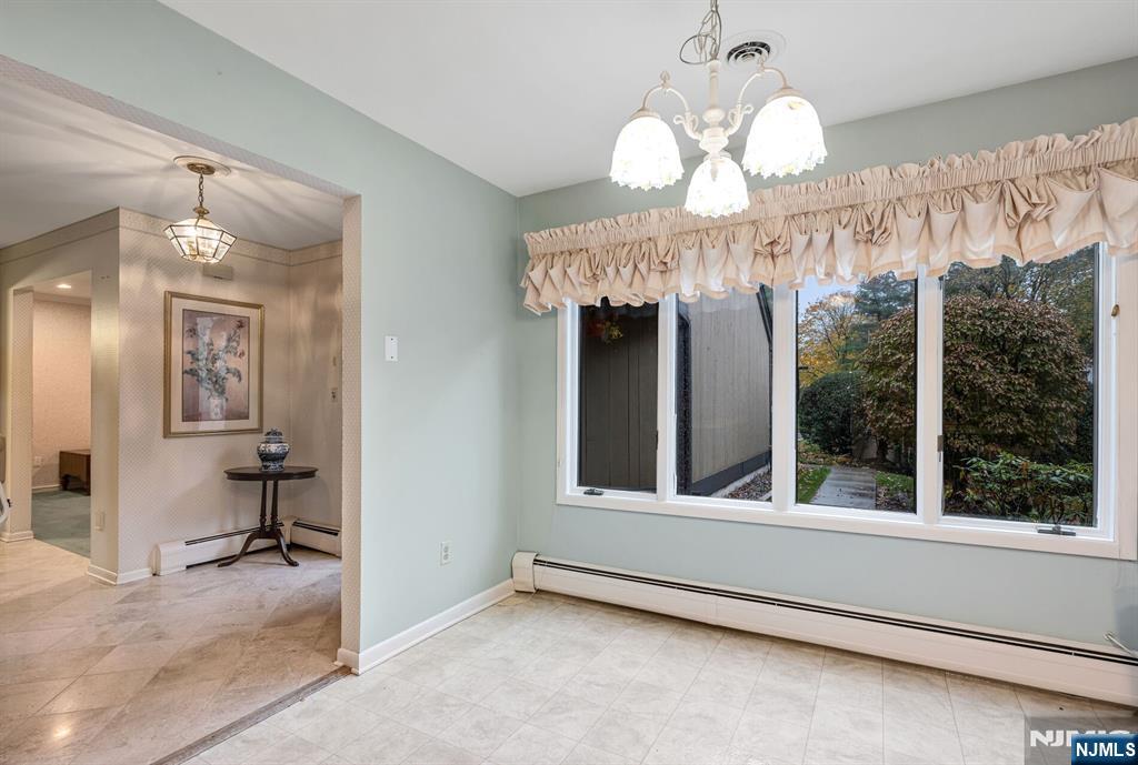 444B Bromley Place Wyckoff, NJ 07481 - Photo 8 of 26 an empty room with wooden floor and windows
