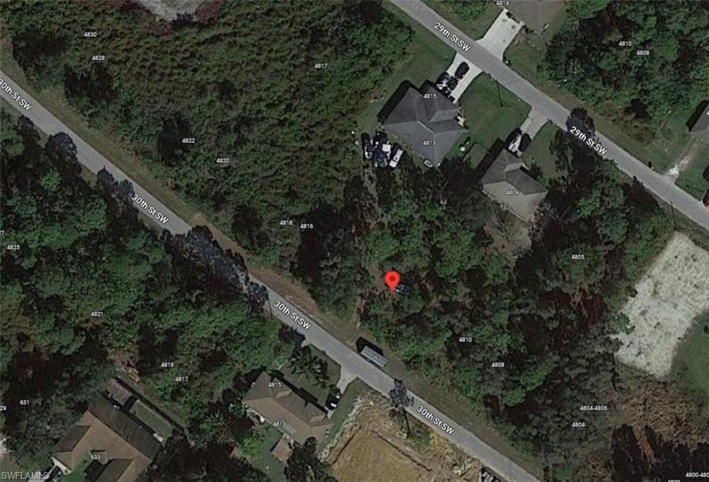 4812-4814 30th Street Southwest Lehigh Acres, FL 33973 - Photo 5 of 5 an aerial view of house with yard