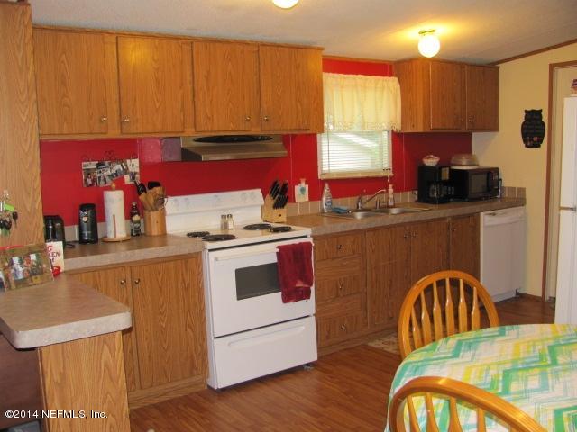 1880 Farm Road Jacksonville, FL 32218 - Photo 3 of 21 kitchen is big lots of cabinets
