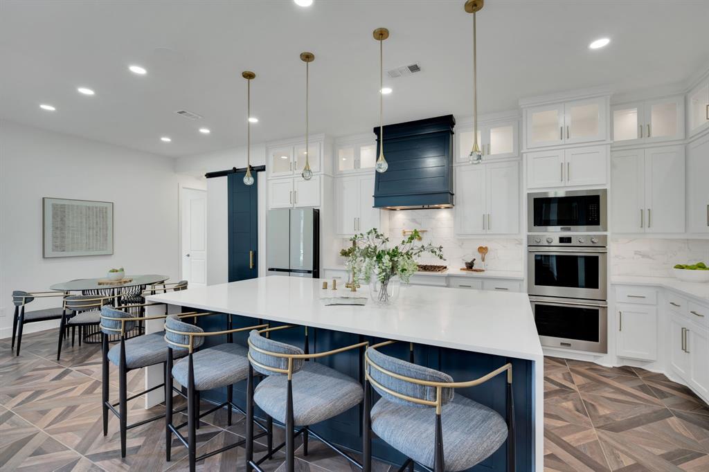 1516 M3 Ranch Road Mansfield, TX 76063 - Photo 15 of 40 Kitchen features Custom cabinetry with lighted uppers with glass doors complete the look. You'll love your gas range, pot filler double oven- all perfect for the chef in your family!
