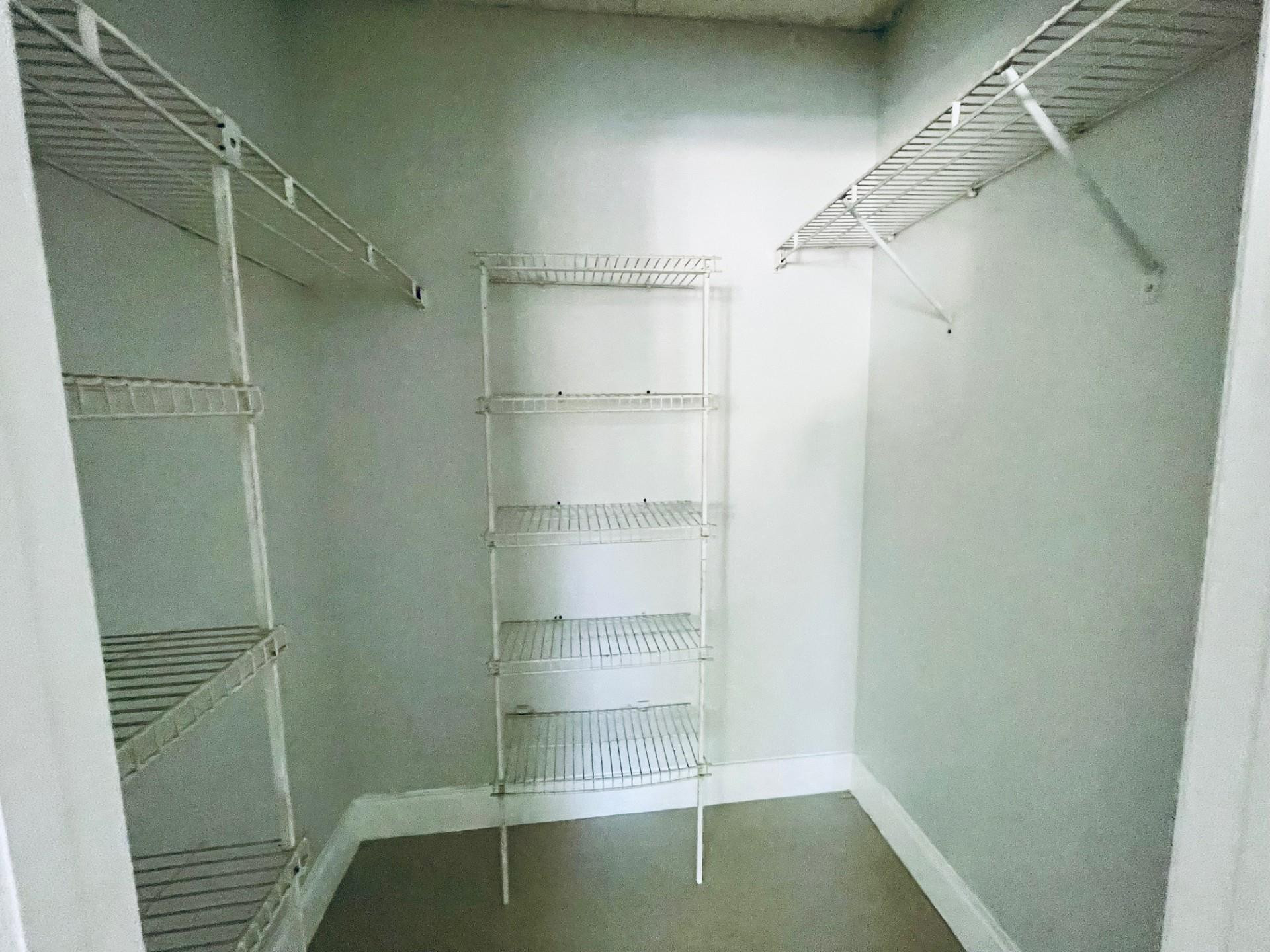 2201 Southwest 80th Terrace, Unit 2201 Miramar, FL 33025 - Photo 15 of 26 a view of walk in closet with empty racks