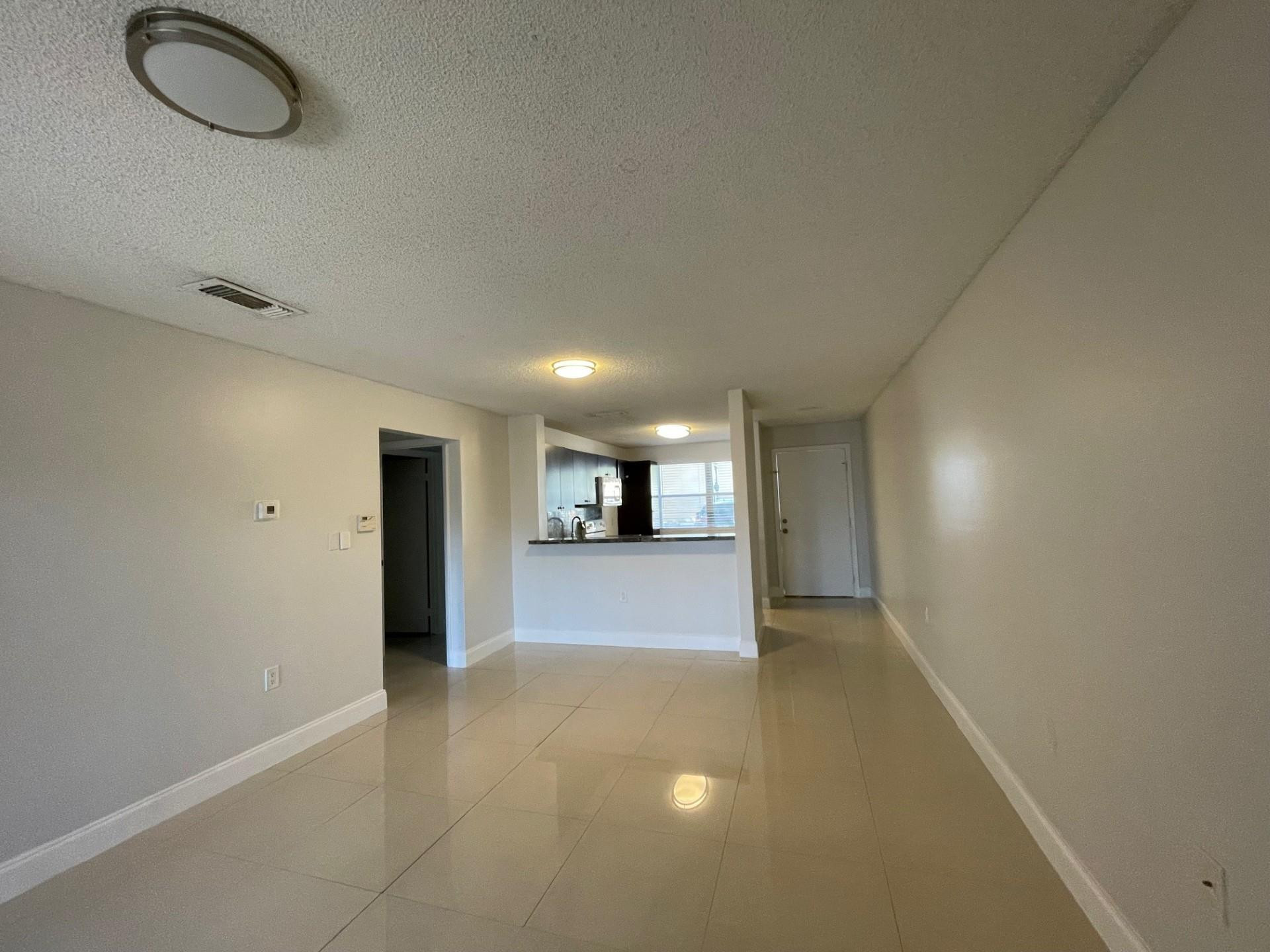 2201 Southwest 80th Terrace, Unit 2201 Miramar, FL 33025 - Photo 19 of 26 a view of a livingroom and a natural light