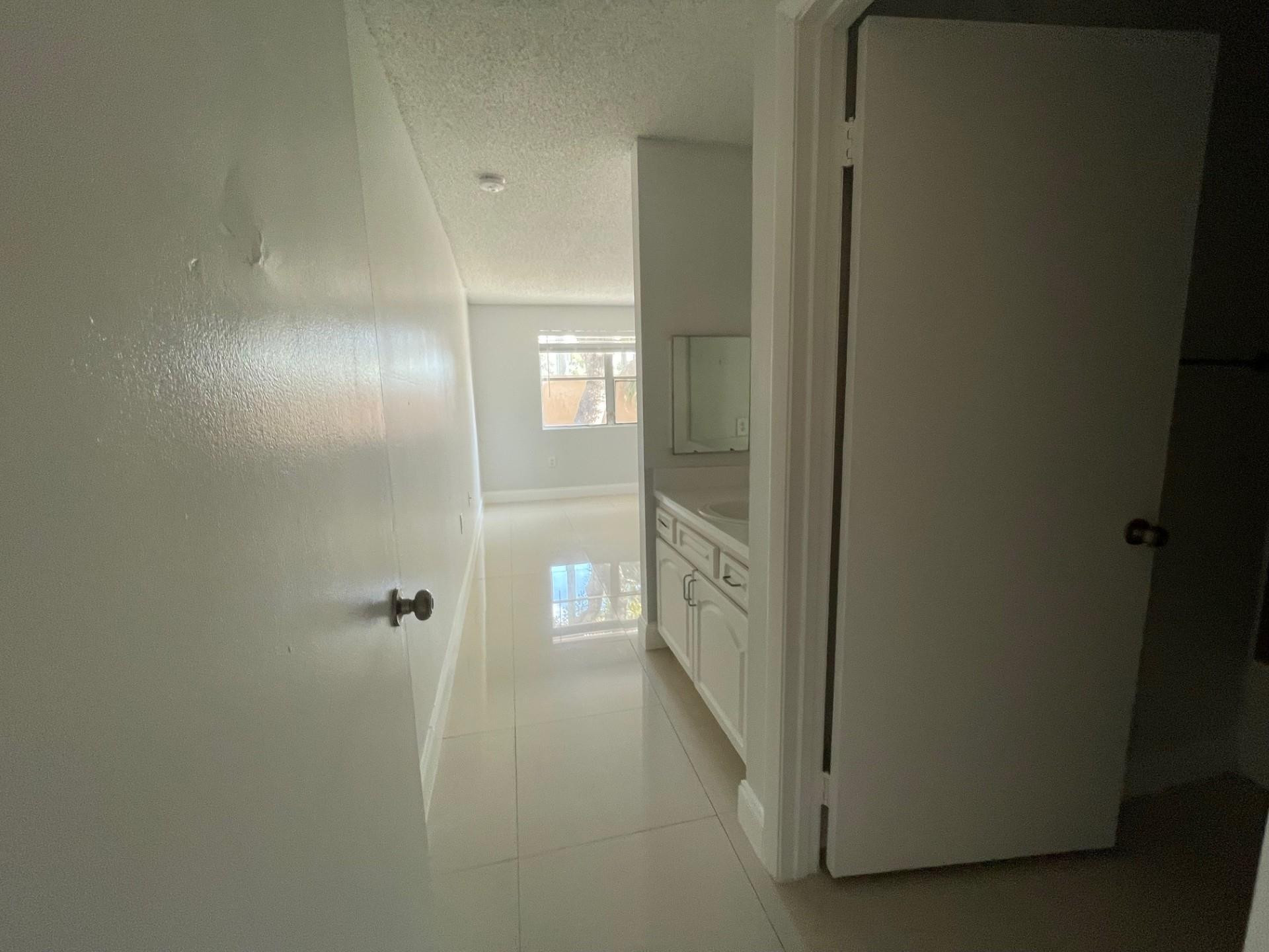 2201 Southwest 80th Terrace, Unit 2201 Miramar, FL 33025 - Photo 22 of 26 a bathroom with a shower