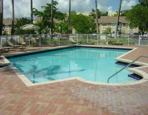 2201 Southwest 80th Terrace, Unit 2201 Miramar, FL 33025 - Photo 24 of 26 a view of a lake with a house