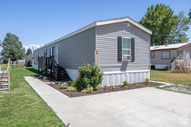 4 Sunset Lane Preston, ID 83263 - Photo 1 of 1 View of side of property with a lawn, a patio, and stairs