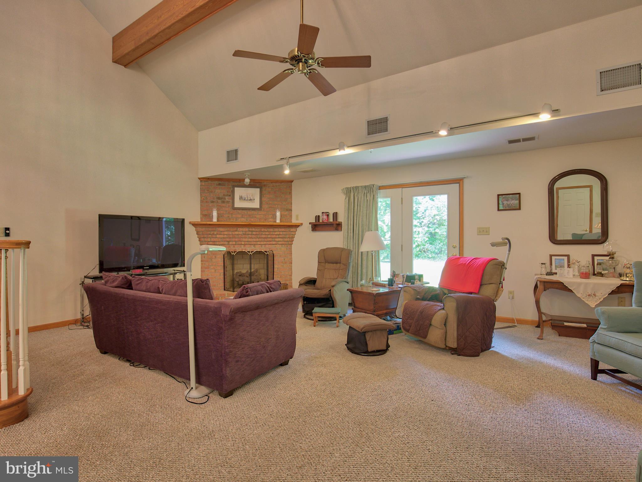 2619 Apple Pie Ridge Road Winchester, VA 22603 - Photo 28 of 29 a living room with furniture and a fireplace