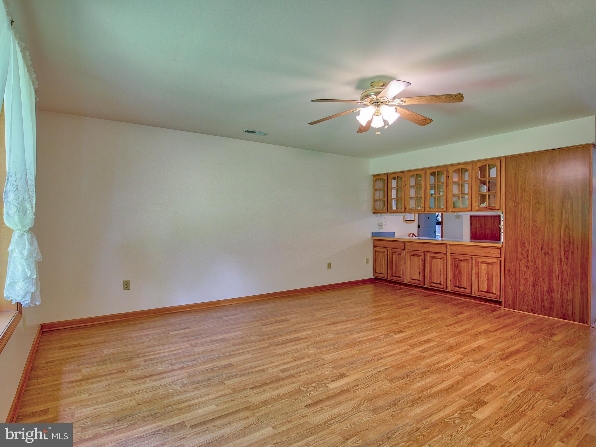2619 Apple Pie Ridge Road Winchester, VA 22603 - Photo 16 of 29 a view of an empty room with window and wooden floor